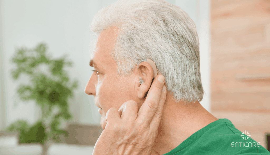 enticare-man-adjusting-hearing-aids